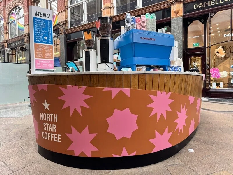 An image of the exterior coffee bar signage and menu.